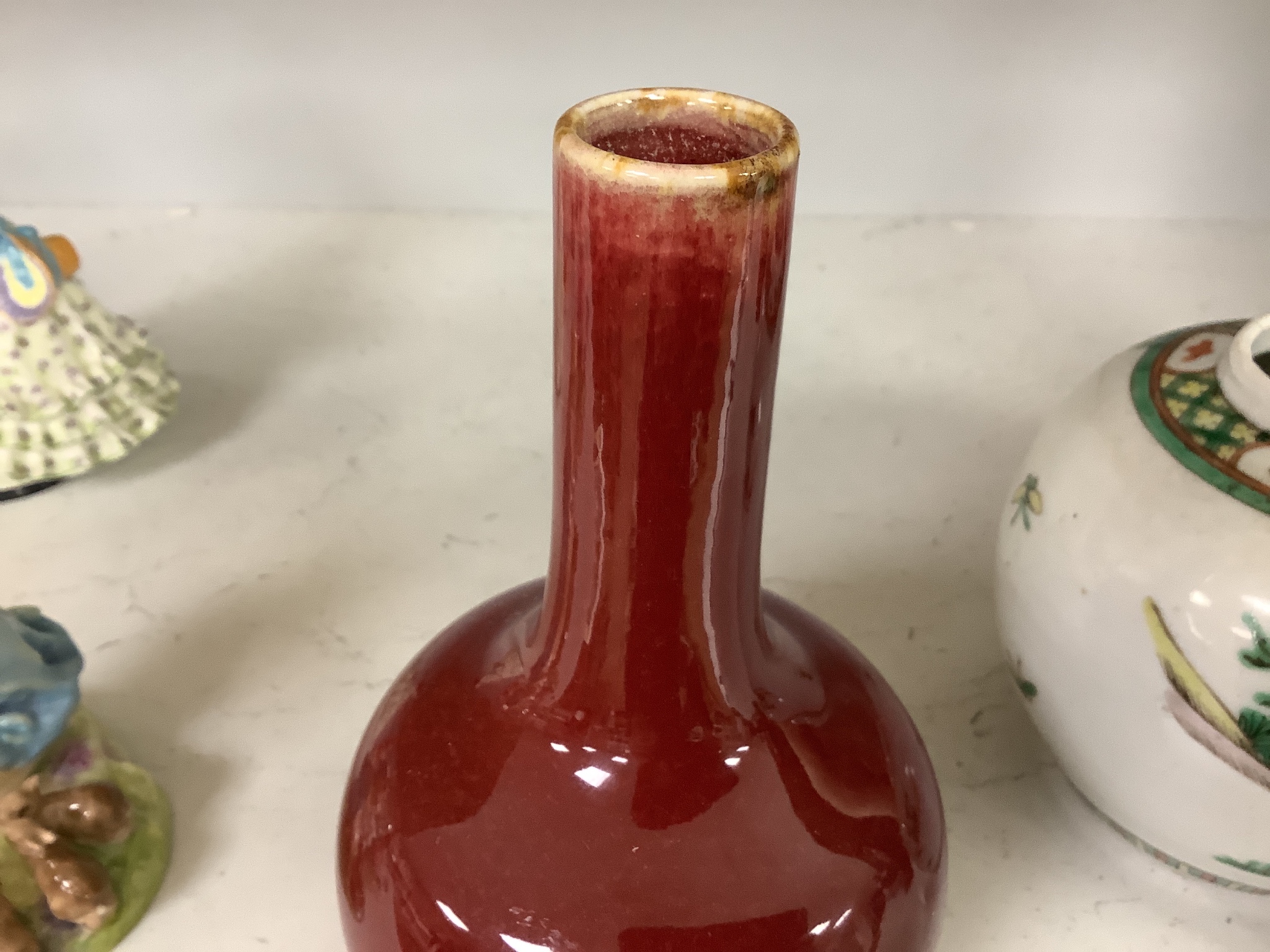 A Chinese famille verte jar and a sang de boeuf vase